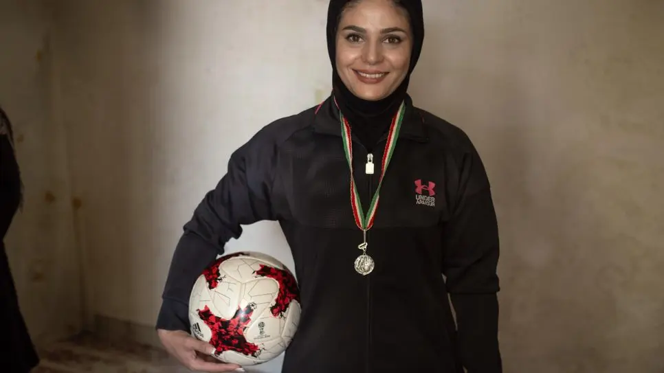 Afghan sports coach helps young refugees find a path to school in Iran