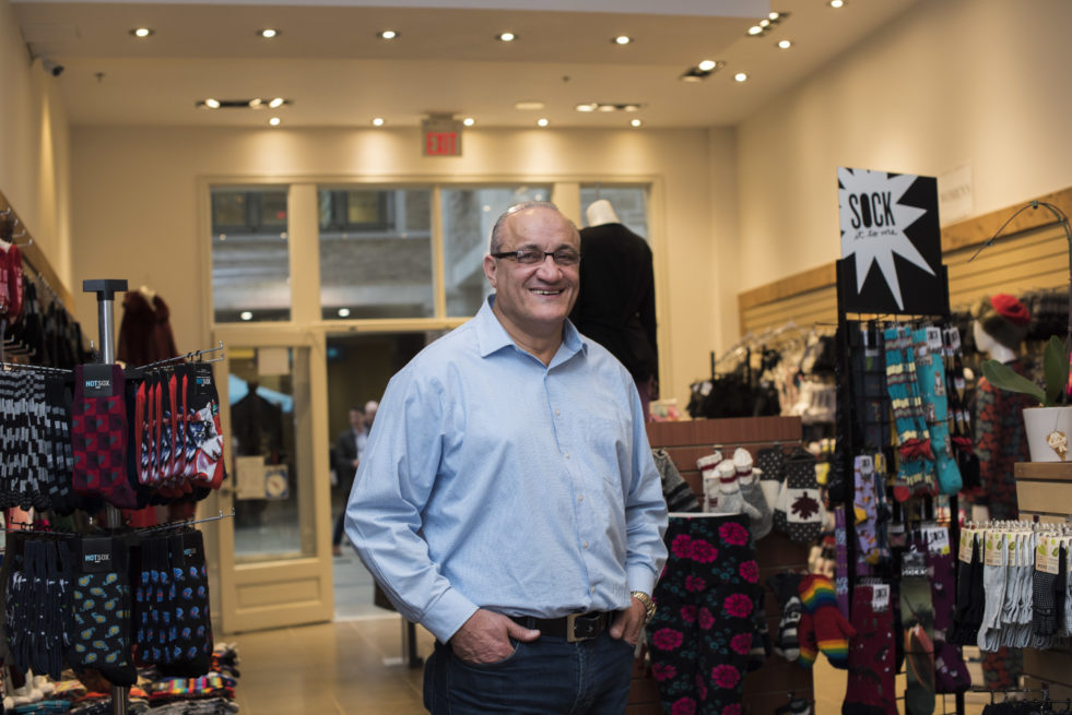 Man standing in front of sock store