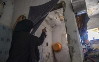 Woman pointing at rain leaks