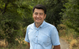 Nansen award winnder Azizbek Ashurov stands on a trail in Kyrgyzstan