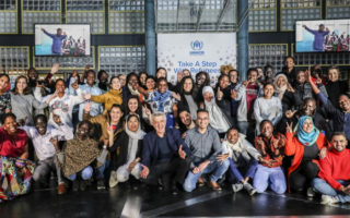 High Commissioner of UNHCR pose with refugees in Geneva