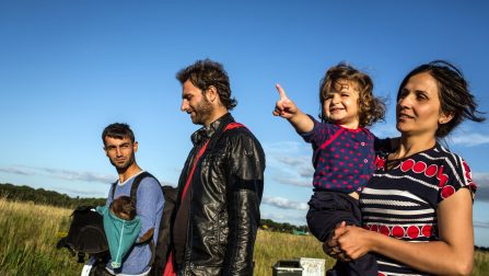 Dara and Naleen are reunited with Merkhaz who arrived the previous day, and the group walk towards the reception centre for asylum seekers, in Ter Apel, Holland. Ter Apel is the location of the only reception centre in Holland for asylum seekers. Dara decided to take his family here after speaking to other members of the Kobane group who had arrived in Germany. They told him that conditions in Germany were crowded, with new arrivals being put in tents. ; The group is made up of over 20 Kurdish refugees who left Kobane at various times since September 2014 and came together in Turkey in order to travel together to Europe. Almost all have had their homes destroyed in Kobane and many have lost relatives and friends in the violence that began when ISIS first besieged the town in September 2014. The group consists of 4 families and a few single men and teenagers, many of them are relatives.