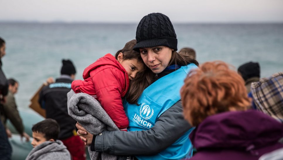 A UNHCR staff member comforts a young refugee boy after his boat landed on the Greek island of Lesvos. ; Over one million refugees and migrants arrived in Europe by sea in 2015. An overwhelming majority were fleeing war and persecution. More than 80 percent of those who survived the crossing came from the world’s top refugee-producing countries.