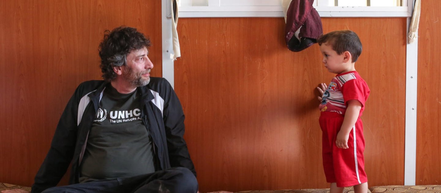 UNHCR High Profile Supporter, Neil Gaiman with Ayman, Syrian refugee volunteer nurse who provides medical assistance to the camp community.