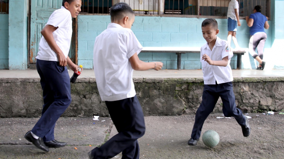 Gangs in Honduras prey on vulnerable youths, recruiting them to be used as foot soldiers in their criminal operations. Here, schoolboys are at play in Tegucigalpa in November, 2019.