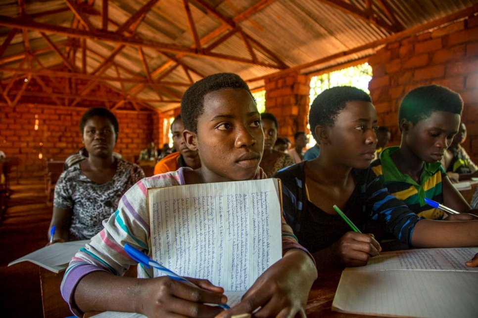 Tanzania. Refugee children battle the elements to learn