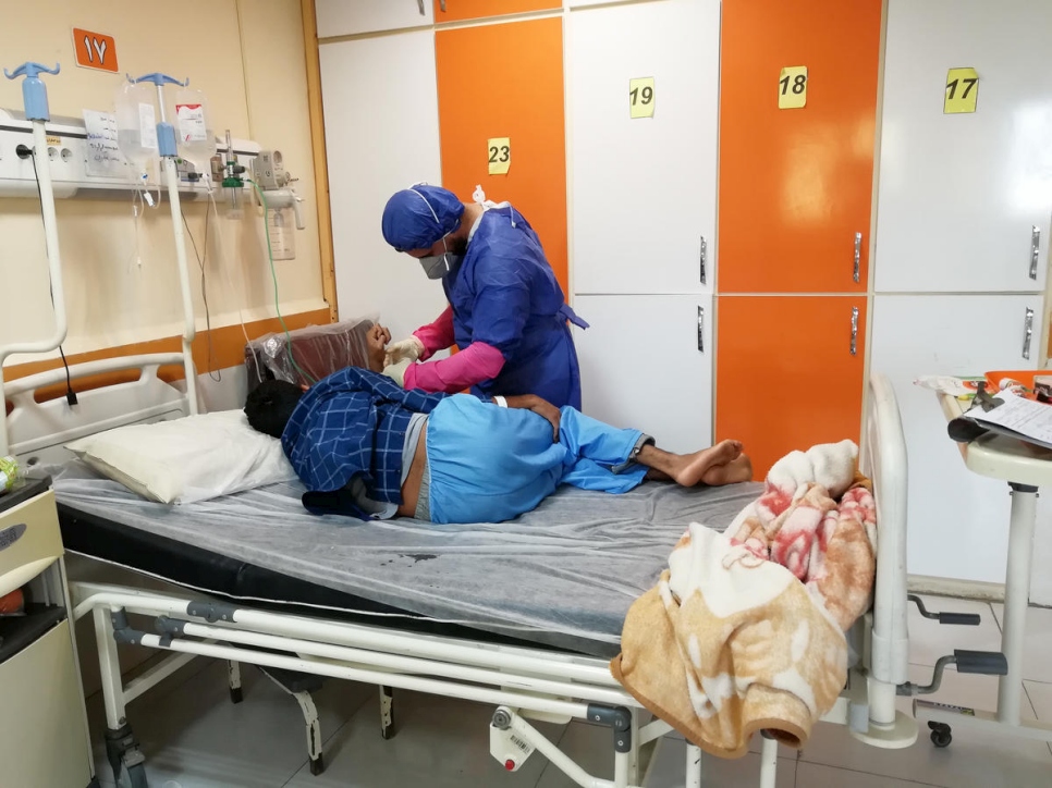 Iran. Moheyman, an Iraqi refugee nurse, treats patients suspected of having contracted the COVID-19 in the south of Iran.