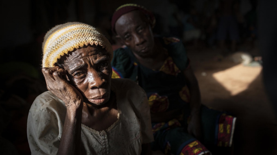 An elderly woman sits in a hall where Anglophone refugees from Cameroon wait to be relocated at the Agadom Refugee Settlement in Ogoja, Nigeria, April 2019.