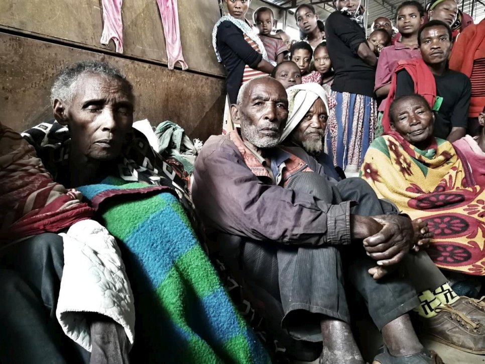 A group of people rest at the Yirga Chefe site for internally displaced people in Ethiopia.