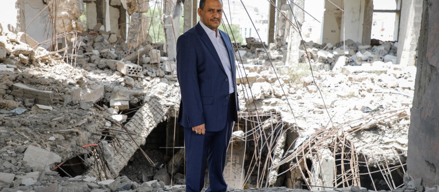 Ameen Hussain Jubran, head and founder of the Yemeni non-governmental organization Jeel Albena, inside a house destroyed by an air strike in the city of Sana'a. UNHCR is honouring Jeel Albena with the prestigious UNHCR Nansen Refugee Award for 2021.