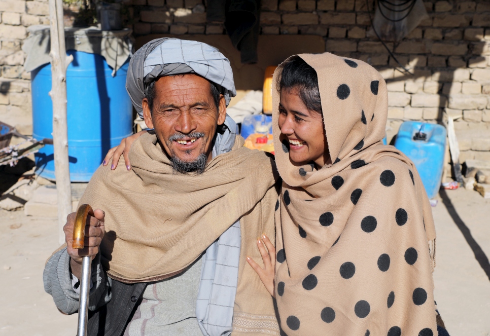 Mahbooba Afghan with her father at their family home in Quetta, Pakistan. 