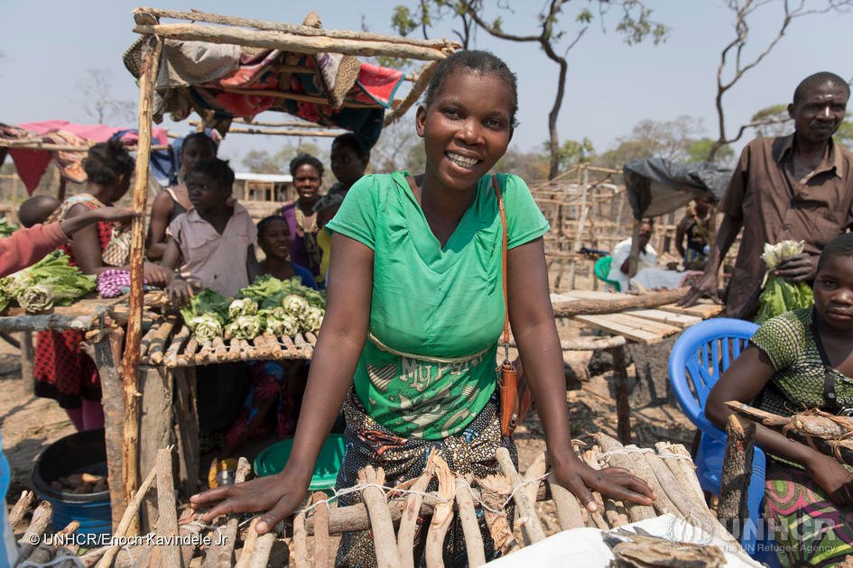 Bwalya, 28, is a Zambian trader from the nearby village of Kampampi who regularly comes to Mantapala Settlement to sell fish she buys from traders along the road to Nchelenge. She is saving up the money she makes for her education. 