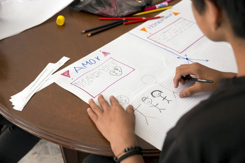 A child draws at a UNHCR-supported shelter in Mexico City for unaccompanied minors from northern Central America, November 2019.