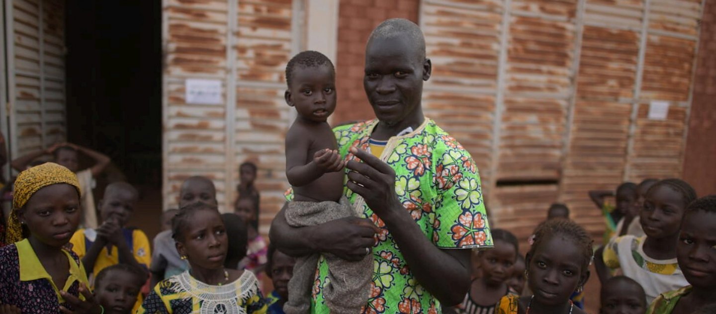 A father and his child at a centre for internally displaced families in Ouahigouya, Burkina Faso.