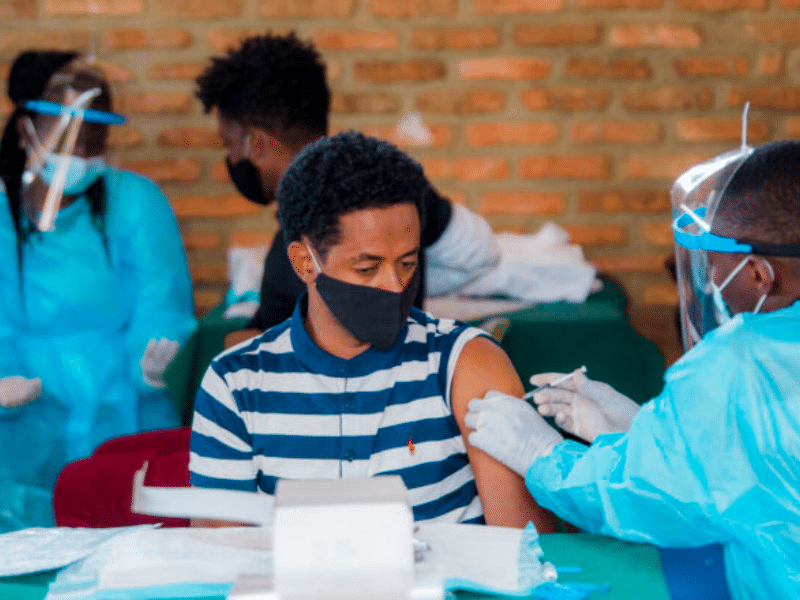 A refugee receives his COVID-19 vaccination at the Gashora Emergency Transit Mechanism centre in Rwanda