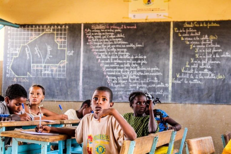 Malian refugee children study at an UNHCR-supported primary school in one of the refugee camps in Burkina Faso