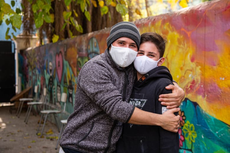 Venezuelan Angel González and his son Angel Santiago Gonzalez hug