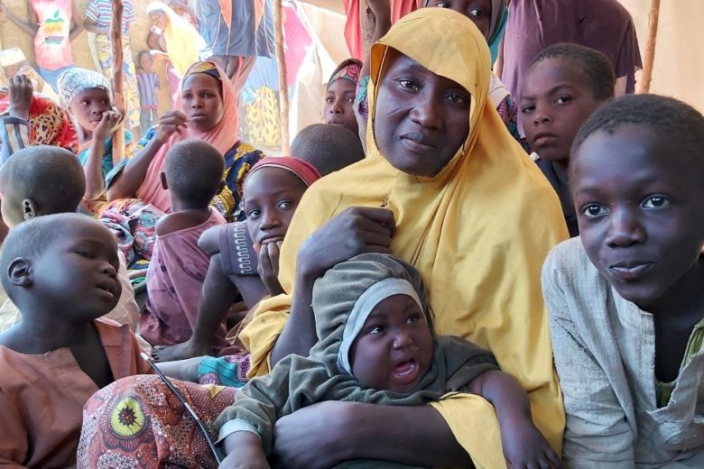 Woman and her seven children.