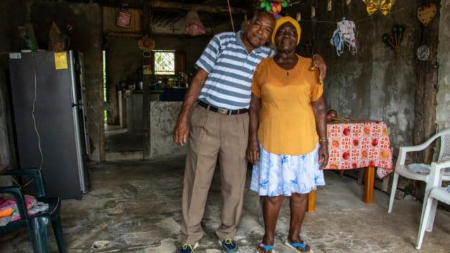 Couple poses in their home.