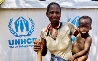 A woman holds her child in Burkina Faso