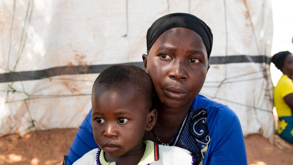 Mamouna Ouédraogo was displaced from her hometown over a year ago. She lives with her mother-in-law and seven children, including one-year-old Alexandre, in Kaya, Burkina Faso. 
