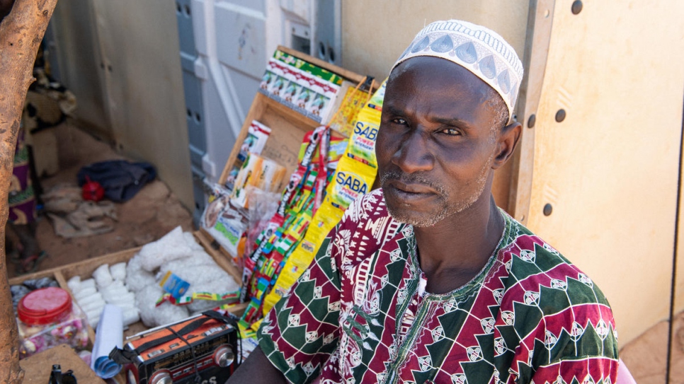 Sambo Maiga sells small items from a stand in front of his shelter in Kongoussi.