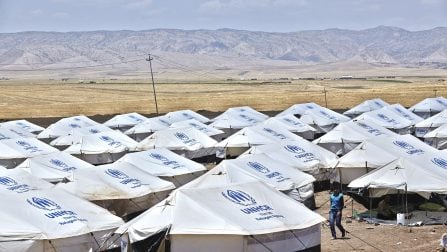 Iraq / IDPs / An internally displaced person from Mosul walks inside of the Garmava transit camp near a checkpoint on a road between Mosul and Dahouk in Iraqi Kurdistan, Thursday, June 14, 2014. In the past two days 53 people from nine families fled Mosul and took refuge at the site. The camp will have the capacity to initially host some 3,000 people. UNHCR monitoring teams report that many of the 300,000 people who have sought safety in the Erbil and Duhok governorates arrived with little more than the clothes they were wearing. Many people have no money, and nowhere to go. While some stay with relatives, others are temporarily in hotels where they are exhausting what funds they have. Many families in Duhok are also sheltering in schools, mosques, churches and unfinished buildings. / UNHCR / S. Baldwin / June 2014