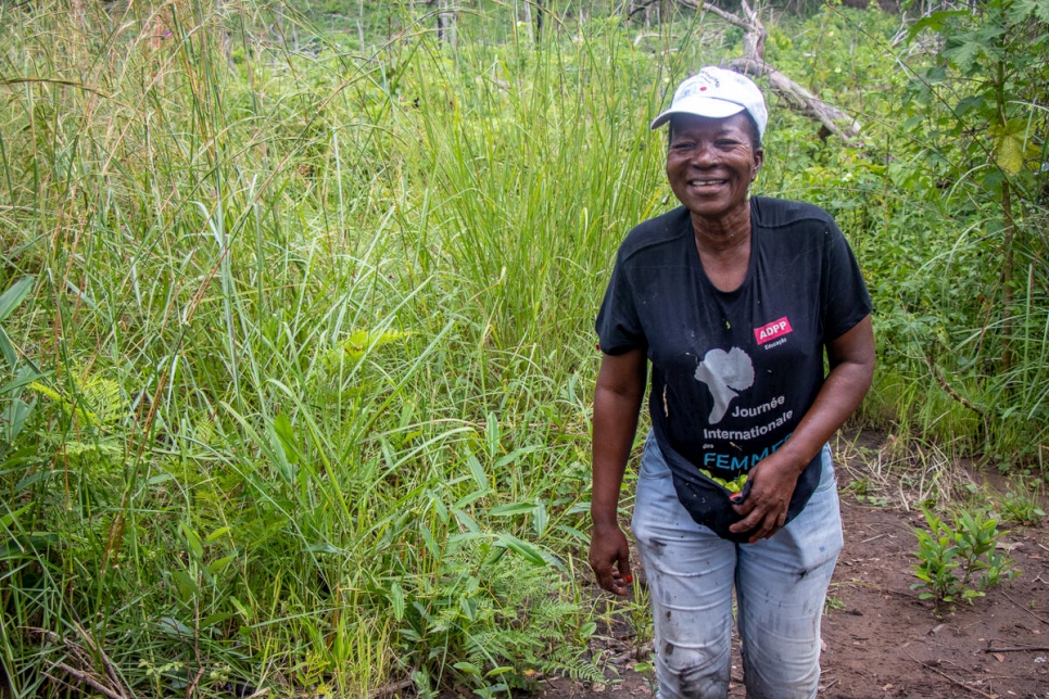 Congolese farmer Antoinette emerges from her rice farm in Chamassuia village near Lôvua settlement, Angola. 
