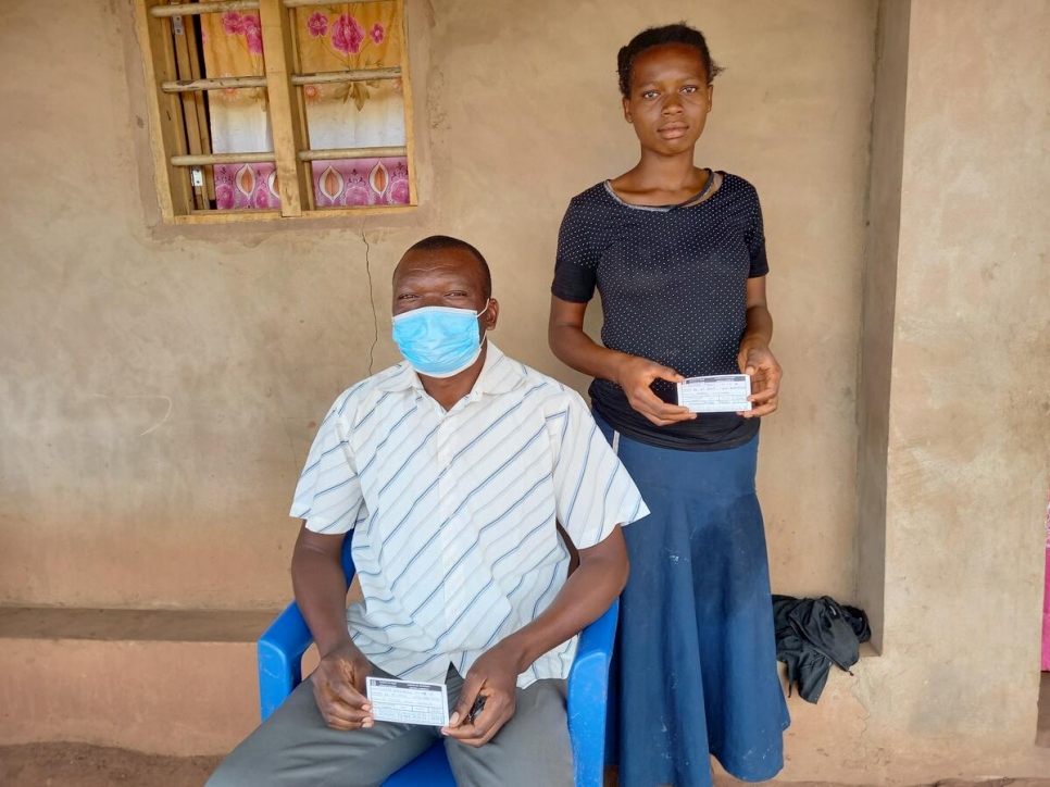 Angola. Refugees shows proof of covid-19 certificate at Lovua settlement