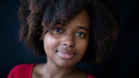 UNHCR, the UN Refugee Agency - Bahati Ernestine Hategekimana looks straight into the camera, hinting a smile. The 25-year old is studying nursing thanks to the DAFI scholarship she won in 2014. 