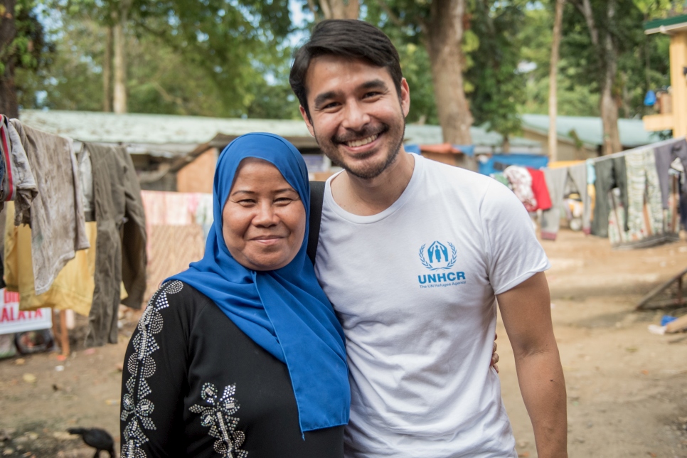 Atom shares a light moment with Fatima, who lost four of her seven children to the conflict in Marawi City, Philippines. This photo was taken more than six months after armed conflict broke out. Fatima tries to find resilience by focusing on her livelihood.