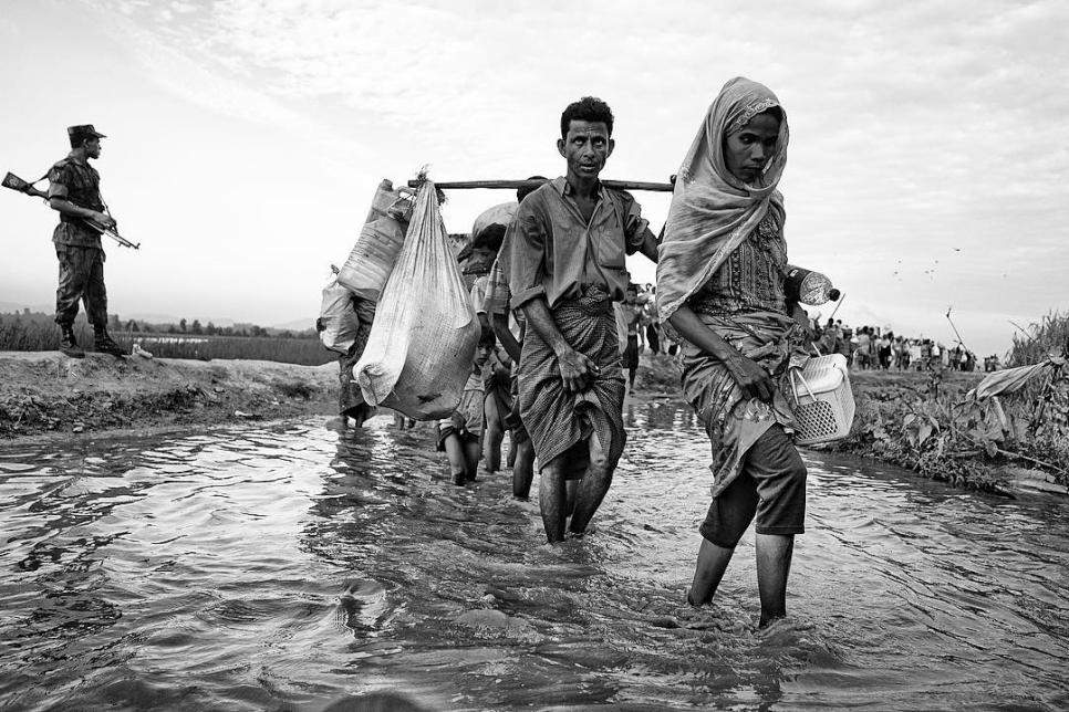 "Rohingya refugees cross the border in Anjuman Para, Bangladesh. Many have walked for weeks in the forest to hide from the military. They are weak and exhausted upon reaching the border," writes Atom of this scene he photographed whilst on mission with UNHCR, November 2017.