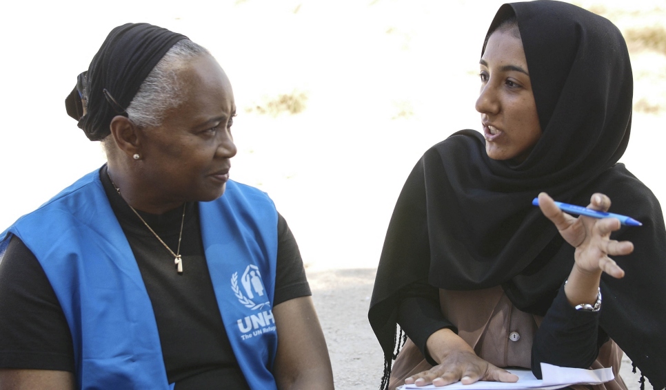 Barbara speaks to Madia, an Afghani refugee.