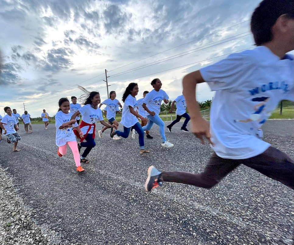 Belize. World Refugee Day 1.5M run in  Bella Vista, Toledo district