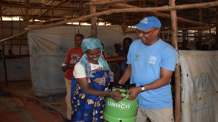 A woman is given a LPG gas stove