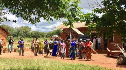 A group of women dancing outside