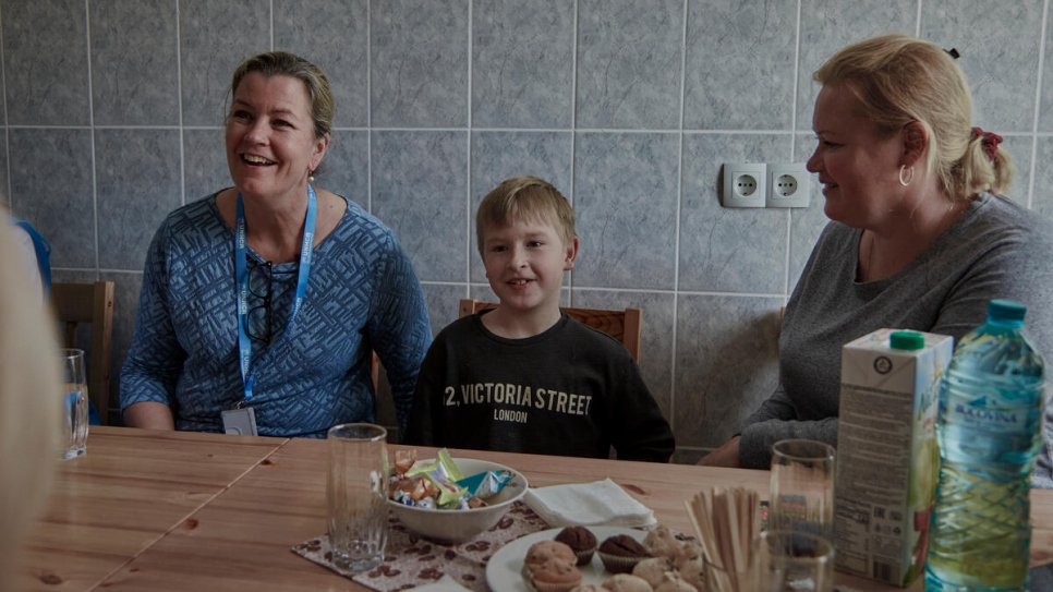 UNHCR Deputy High Commissioner Kelly T Clements (left), meets Olga and Sergey at the converted university dorm where they live.