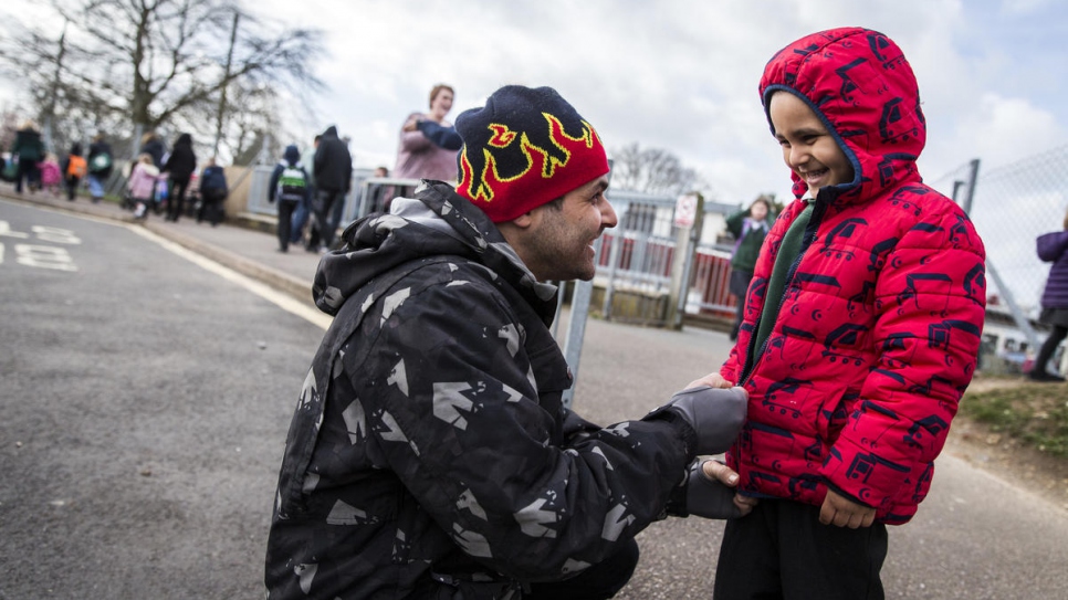 Hani Arnout, 34, picks up his son Abdul, 4, from school, in Ottery St Mary, Devon, south-west England.