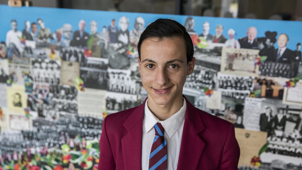 Adel Khaled Jhayem, 14, shows off his school uniform at his new school in Liverpool. Adel speaks the best English in his family and acts as translator. His first class in England was chemistry, where he learnt about ionic bonding. He hopes to become a doctor, remembering how hard it was to access medical care in Lebanon.