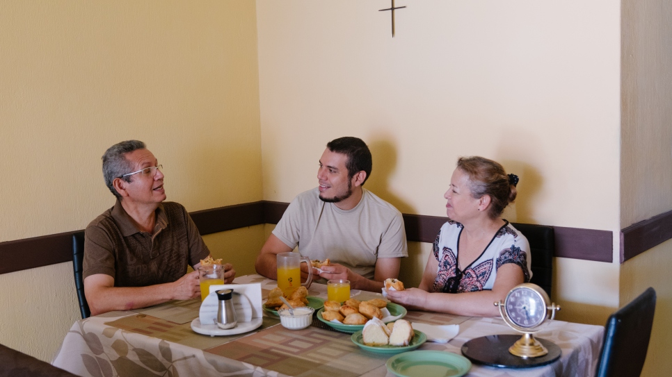 Héctor, Leo and Yesmaira take a break from their sweets confection to enjoy a family breakfast.