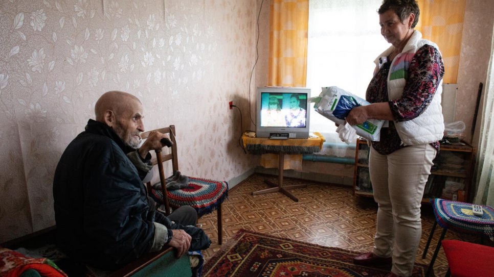 Tetiana visits Viktor Akimov, 82, regularly, bringing him and his wife food and medicines. 