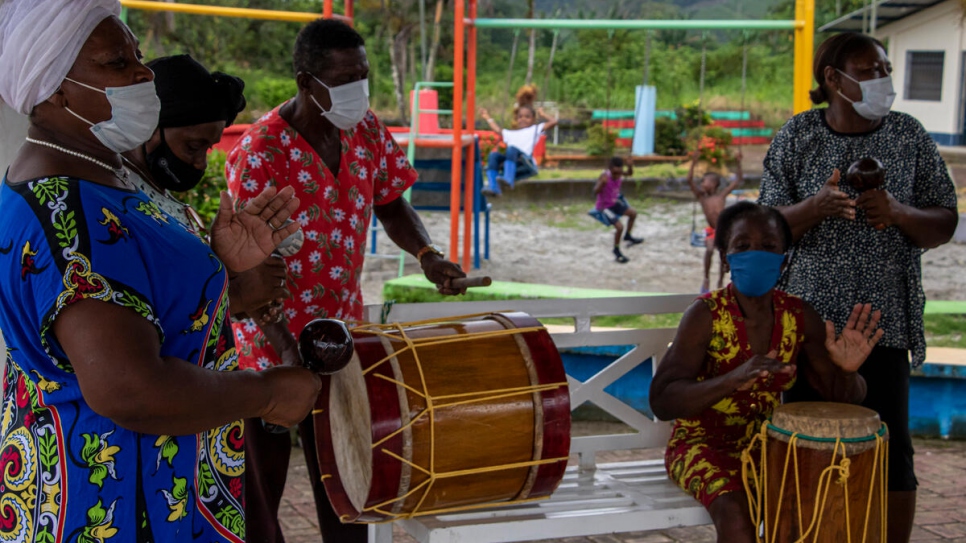 Members of Tía Gachita play their traditional 'arrullo' rythms at a park in Calderón, Ecuador.