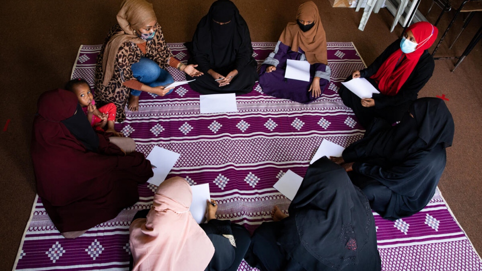 Naima facilitates a peer support group session with other Somali refugee women. The sessions allow the women to speak about their experiences of gender-based violence and gain strength from each other.