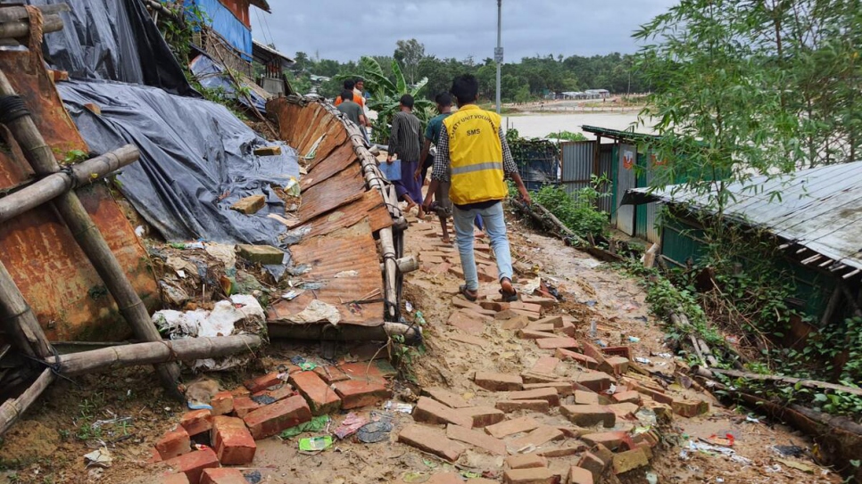 Refugee volunteers worked day and night in heavy rain to rescue refugees stranded by severe flooding in the camps.