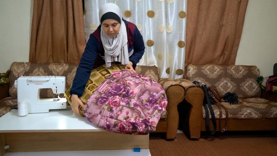 Zuzan Mustafa, 36 from Aleppo, Syria, fled with her husband and three children to Jordan. Syrian refugees in Jordan face challenges finding work. Zuzan was able to rely on her sewing skills to make a living. 
