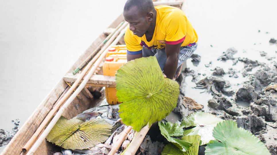 Malian fisherman Yahya Koronio Kona inspects the fish he's caught in Lake Mahmouda in Mauritania.