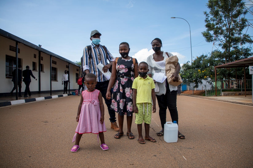 Donatien stands with his family at the border crossing in Kirundo Province, Burundi.