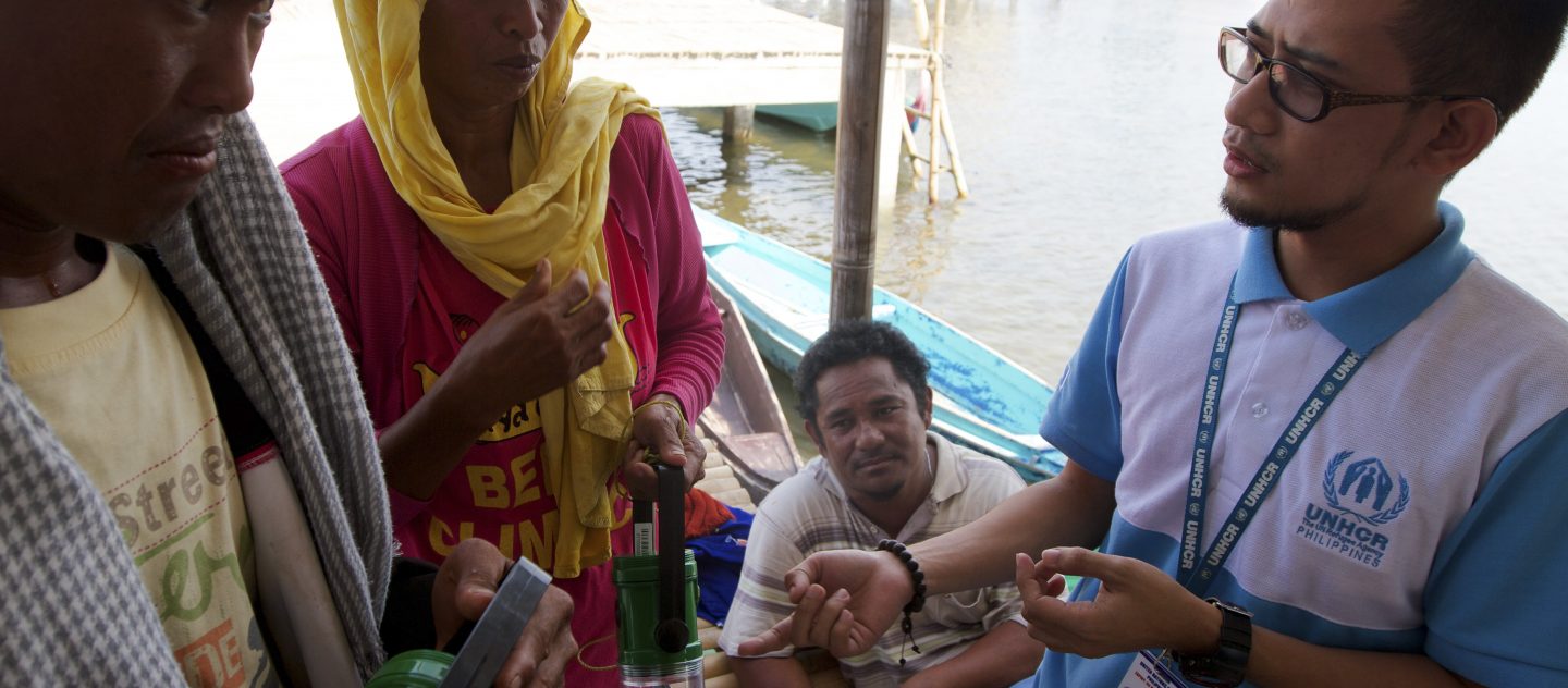 'Philippines / UNHCR distributes solar lanterns to families in the island sitio of Layag-layag who do not have access to electricity. © UNHCR/Kent Truog