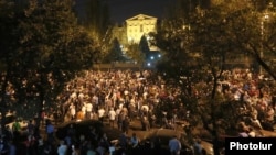 Supporters of Armenian Prime Minister Nikol Pashinian protest outside the parliament building in Yerevan.