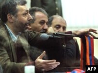 Former Foreign Minister Aleksandr Arzumanian (left) defends himself during his trial in Yerevan in December.